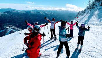 Skiers on mountain slope